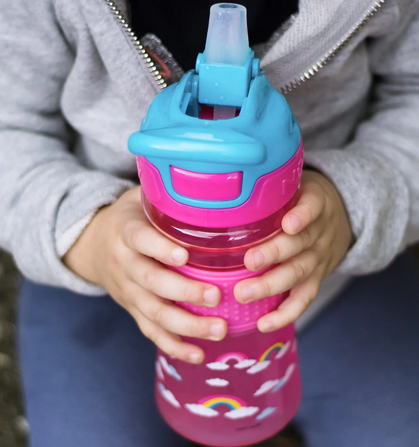 Nuby Thirsty Kids Push Button Flip-it Soft Spout on The Go Water Bottle with Easy Grip Band, Pink Rainbow, 12 Oz