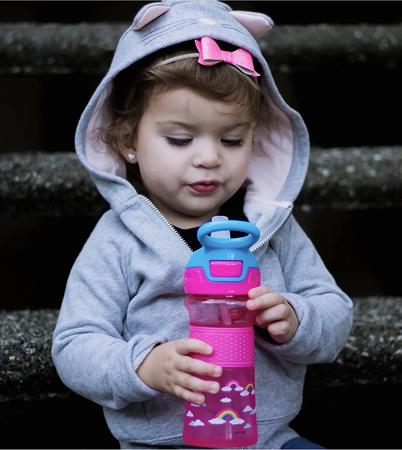 Nuby Thirsty Kids Push Button Flip-it Soft Spout on The Go Water Bottle with Easy Grip Band, Pink Rainbow, 12 Oz